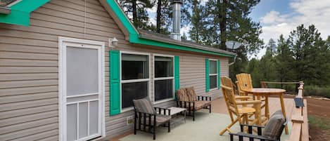 Spacious back deck to relax and view the deer, wild turkeys and birds that frequent the area