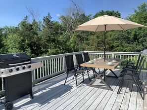 Spacious patio with a propane grill