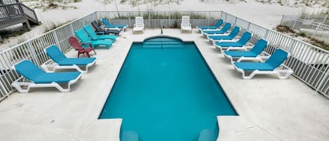 Pool with sun deck chairs