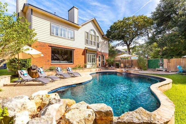 How do you spell paradise? (Heated)Pool, Hot Tub, waterfall, three dedicated seating areas, bbq grill, pool toys and a private fenced yard with awesome landscape lighting. Enjoy the great outdoors!