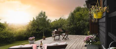 The patio and view at Hooting Owl Retreat, Somerset