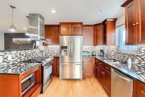 The beautifully updated kitchen provides ample room for your entire group to cook and entertain.