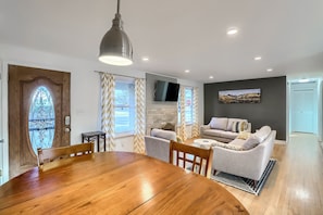 The kitchen seamlessly flows into the welcoming dining space, with seating for 4.