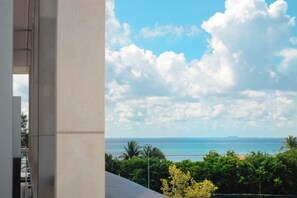 Private terrace with outdoor furniture and city and ocean view