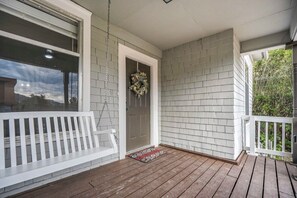 Make a fresh cup of coffee and enjoy the morning air as you swing on the perfect front porch!