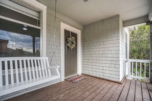 Make a fresh cup of coffee and enjoy the morning air as you swing on the perfect front porch!