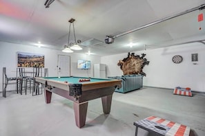 Kick back in front of the large 55" Smart TV, get competitive in a game of pool, or hang out and enjoy a game of corn hole!