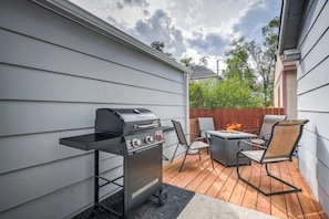 Enjoy the private deck right out back complete with a fire pit, BBQ grill, and outdoor dining table!