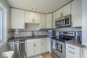 Discover culinary delight in this fully equipped kitchen