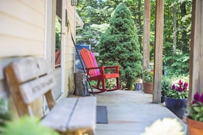 Porch at entrance from driveway, great place to read a book!
