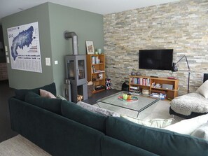 Furniture, Flooring, Wall, Interior Design, Couch, Living Room, Floor, Television, Room, Electronic Device