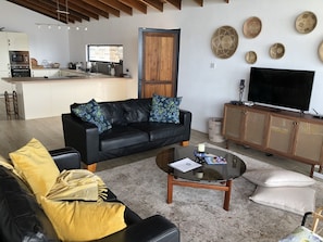 Large comfy living room with boho coastal chic style