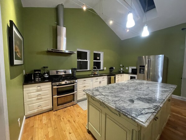 Kitchen with a gorgeous Marble Island and stainless steel appliances