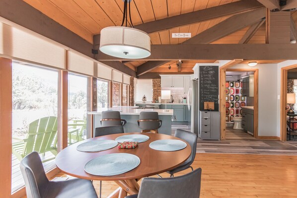 Every space in The Glass House is curated with thought and intentionality.  The indoor dining space overlooks the wraparound deck so you can enjoy the view from every angle.