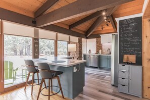 The newly remodeled kitchen features new everything!  The mid-century Craftsman look is especially evident in the kitchen and breakfast bar.