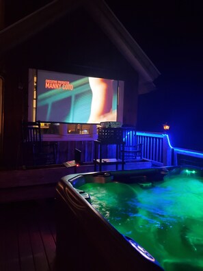 Hot Tub & Outdoor Theater at nighttime. 