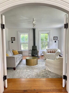 Second half of the living room with cast iron wood stove.