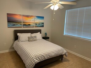 Spacious Queen Size bedroom .  Sealy Posturepedic mattress  ceiling fan