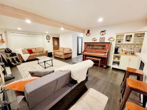 Beautiful Living room with an upright grand piano, big TV, and a coffee nook 😊