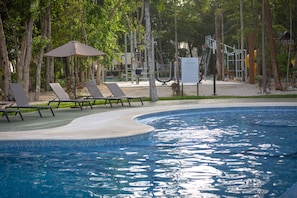 Pool and lounge area with outdoor gym and basketball court.