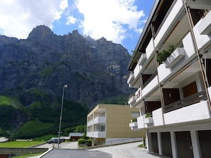Cloud, Sky, Building, Daytime, Property, Mountain, Plant, Window, Green, Slope