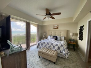 Primary bedroom w/ king sized bed, chest of drawers for plenty of storage and TV