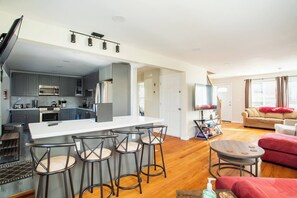 Large Living room with 2 couches and open kitchen