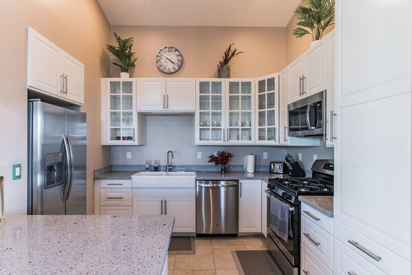 The spacious kitchen includes everything you need to make a favorite meal.  Some extras included are the waffle maker and an air fryer!