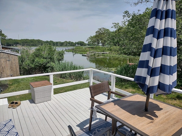 Private deck with seating and gas grill. 