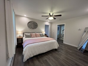 Primary King room from bathroom doorway, full length mirror