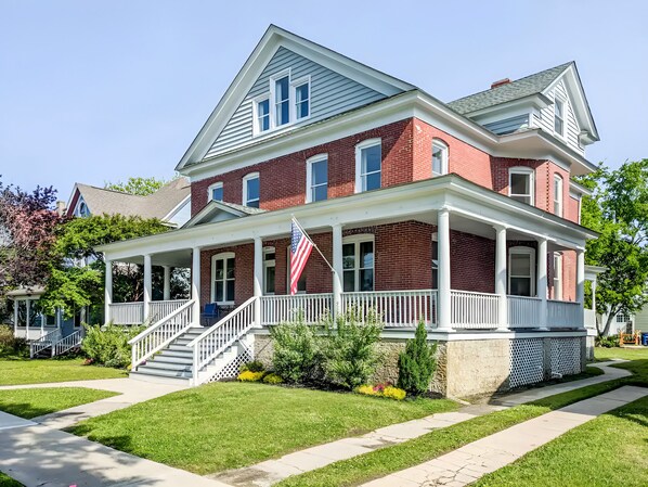 Guests can enjoy the large wrap around porch and its lounge furniture.