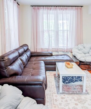 Plenty of lounge seating in the living.