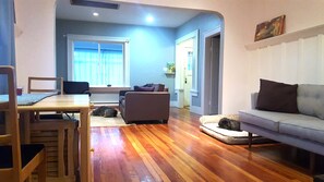 Dining Room open to Living Room.  2 sofas.