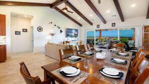 Large open concept great room with dining table for eight
