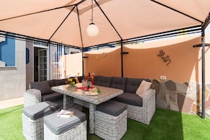 Outdoor seating area with shade pergola