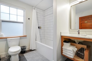 Custom tile and a modern, deep bathtub