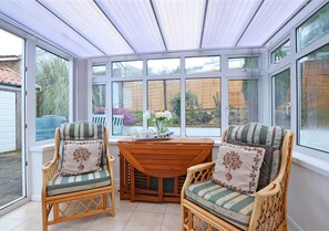 The conservatory adds extra space to relax and has access to the patio and garden