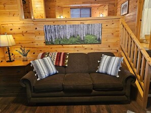 When you enter the cabin, you will see the new comfy couch.