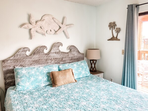 King bed in the master bedroom, black out curtains that open up to private patio