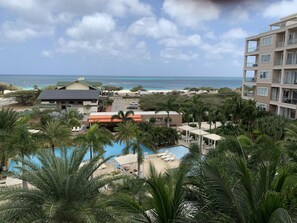 View from balcony, overlooking pool and the Caribbean Sea