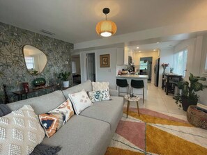 Fun and cozy jungle themed living room with a smart tv. It is also stocked with board games and card games for fun :)