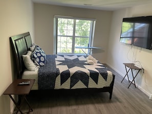 Queen bed with memory with 65”tv