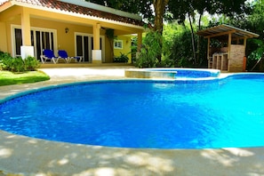 Another View of the pool jacuzzi (not heated)  charcoal bbq and patio.