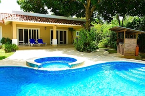 Another View of the pool jacuzzi (not heated)  charcoal bbq and patio.