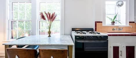 Dinner seating at a marble top table for 3