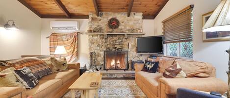 Comfortable Living room with wood burning fireplace on main floor