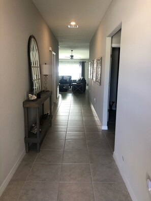 Foyer and hall to secondary bedrooms, bathroom and laundry room.