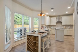 Sit at the breakfast nook that overlooks the backyard