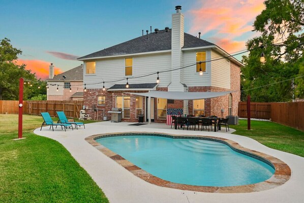 Jump in! The backyard is absolutely stunning, with tons to do including grilling, patio games, swimming, and much more!