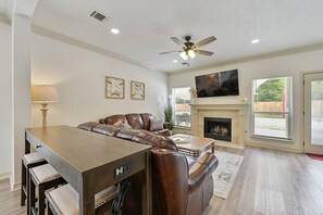 Enjoy fun bar seating overlooking the living room! This is perfect for gamedays so everyone gets to watch without feeling crowded!